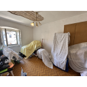 original_1792257663_renovation-room-with-covered-furniture.png