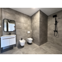 original_1790936392_modern-gray-tile-bathroom-with-black-fixtures.png