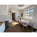 original_1790929383_sunlit-modern-dining-nook-and-hallway.png