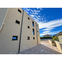 original_1792006931_modern-stucco-courtyard-under-a-cloudy-sky.png