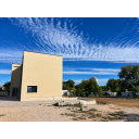 original_1792007193_modern-house-under-a-rippling-blue-sky.png
