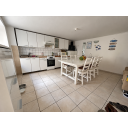 original_1791203900_bright-white-kitchen-and-beach-inspired-dining-area.png