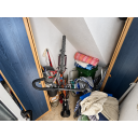 original_1791203917_cluttered-under-stair-bike-storage-nook.png