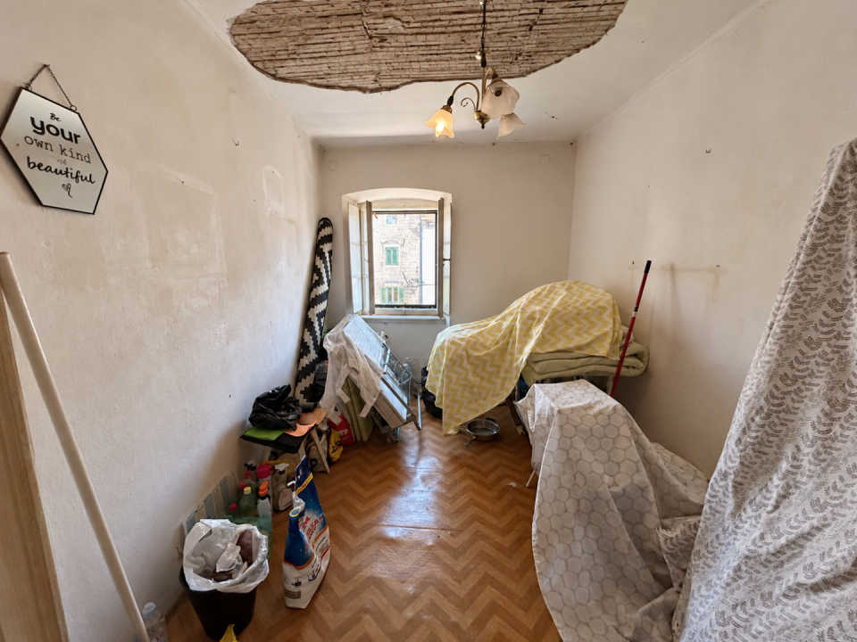 original_1792257668_renovation-storage-room-with-chevron-drapes.png