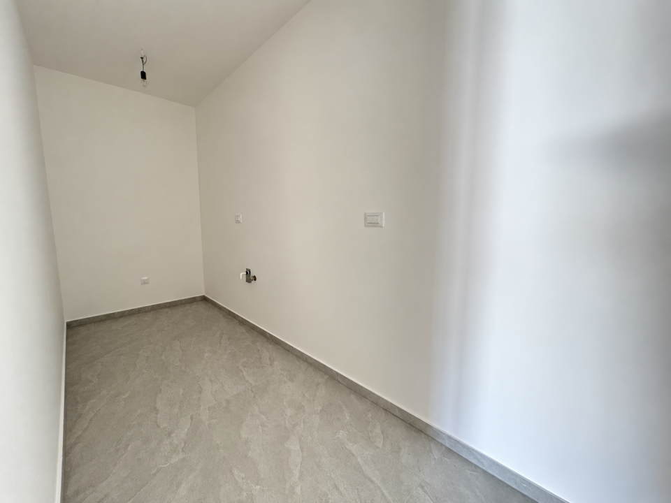 original_1791188524_minimalist-utility-room-with-exposed-light-fixture.png