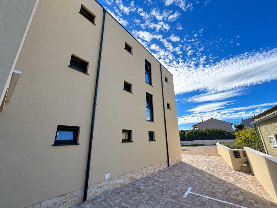 original_1792006931_modern-stucco-courtyard-under-a-cloudy-sky.png