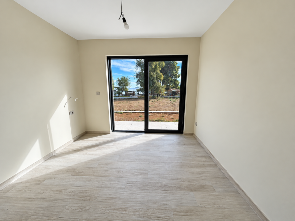 original_1792007021_sunlit-minimalist-room-with-sliding-glass-door.png