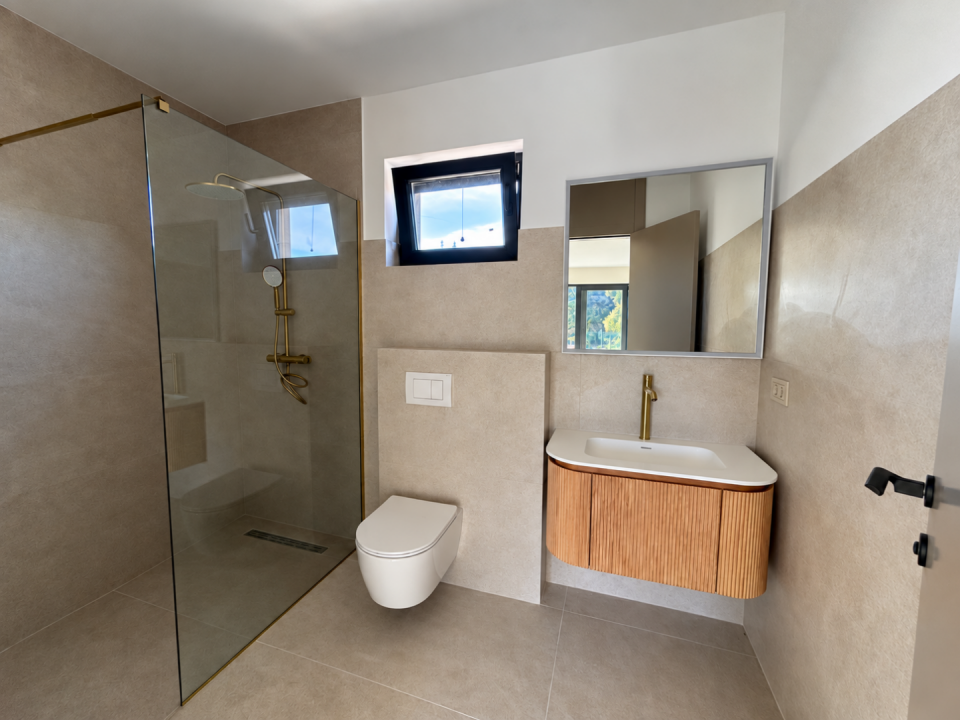 original_1792007285_minimalist-beige-bathroom-with-brass-fixtures-1.png