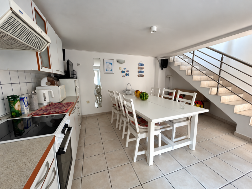 original_1791203840_bright-kitchen-dining-area-under-stairs.png
