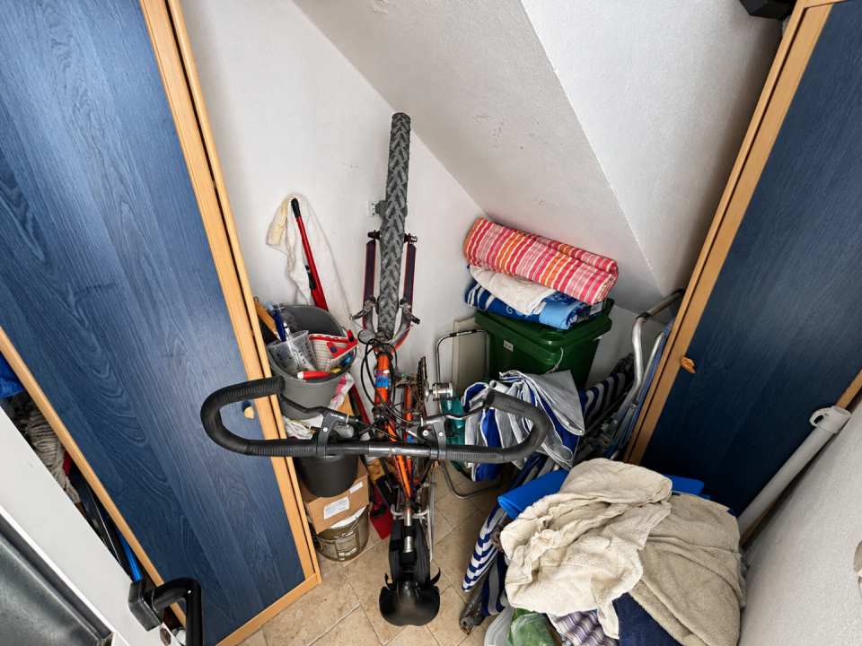 original_1791203917_cluttered-under-stair-bike-storage-nook.png