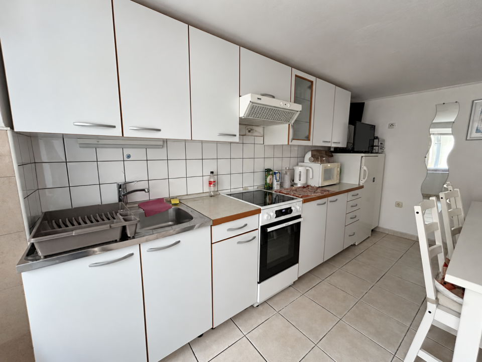 original_1791203954_modern-white-kitchen-and-dining-area.png